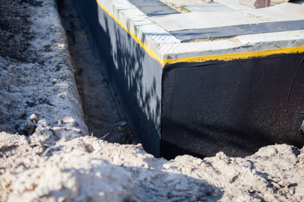 Professional Exterior Waterproofing technician working in Tustin, MI